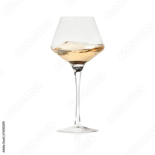 White wine splashing in glass on white background