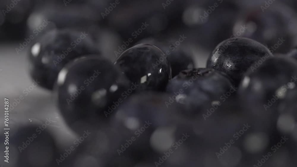 close up macro of organic Blueberry rolling on white table cut board in professional restaurant kitchen healthy fruit diet close up macro of organic Blueberry rolling on white table cut board in professional restaurant kitchen healthy fruit diet