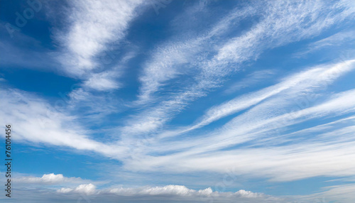 Beautiful blue sky with white wispy clouds, a perfect replacement background for photos