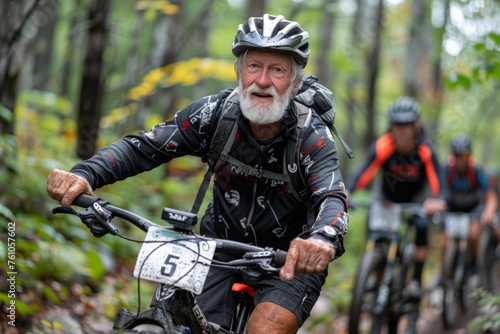 An elderly man mountain biking through the forest.