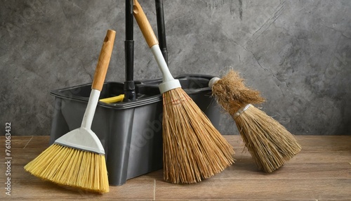 broom and dustpan.a durable and ergonomic WBM Home broom, brush, and dustpan set for efficient cleaning. The composition should feature high-quality materials such as sturdy plastic and natural bristl photo