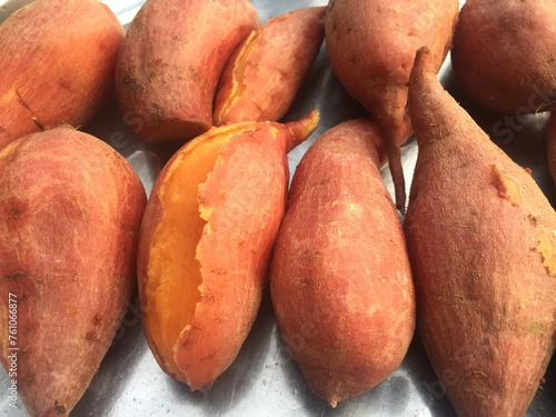 The sweet potato has a thin orange peel. And has orange flesh inside some have white or purple flesh and must be boiled, steamed, or grilled. 