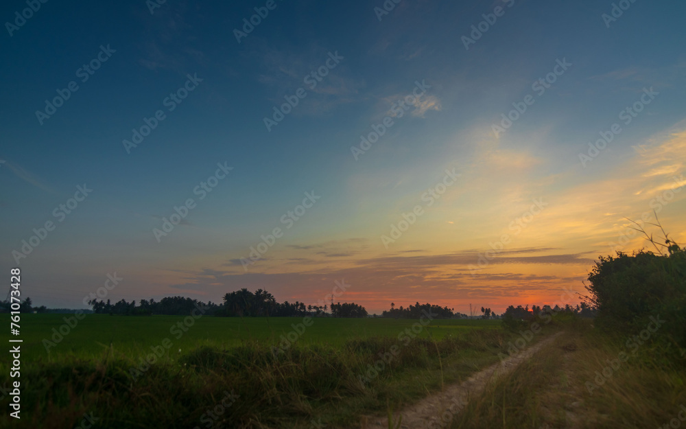 Rural sunset landscape with footpath Rural sunset landscape with footpath