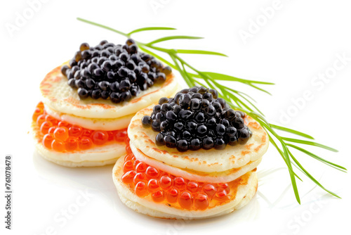 Blinis stuffed with black and red caviar, isolated on white background