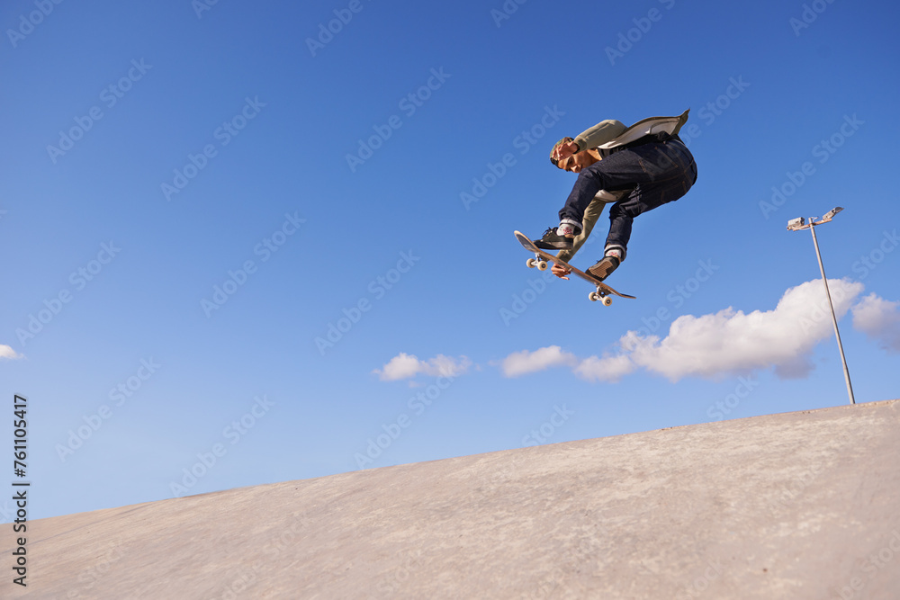 Skateboard, blue sky and man with ramp, fitness and training for a competition and sunshine. Adventure, person and skater with practice for technique and skating style with exercise, energy or cardio Skateboard, blue sky and man with ramp, fitness and training for a competition and sunshine. Adventure, person and skater with practice for technique and skating style with exercise, energy or cardio