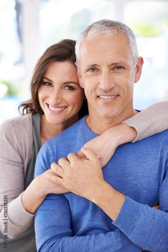 Couple, portrait and happy in home for hug with support, trust and romance in living room of house. Senior man, woman and smile with face for embrace, affection and healthy relationship in apartment Couple, portrait and happy in home for hug with support, trust and romance in living room of house. Senior man, woman and smile with face for embrace, affection and healthy relationship in apartment