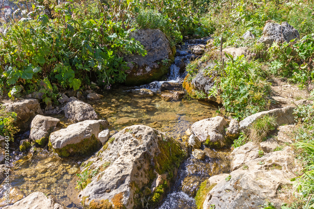 walking along the bed of a mountain river with a visit to unexplored places of the sources of drinking water walking along the bed of a mountain river with a visit to unexplored places of the sources of drinking water