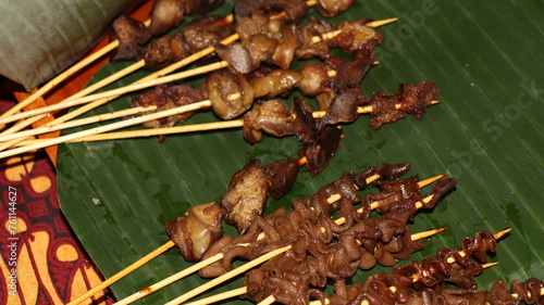 sate usus or chiken intestines satay and sate hati or liver satay. photo