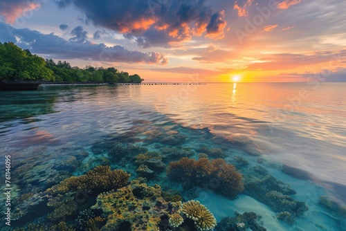 The sun casts a warm glow over the ocean as it sets, illuminating the vibrant colors of the coral reefs, A serene beach sunset with colorful coral reefs beneath the clear waters, AI Generated
