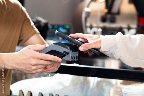 Action of paying with the telephone through a terminal in a business