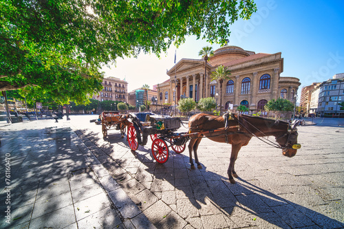 Horse carriage in front of the Massimo theater in Palermo photo