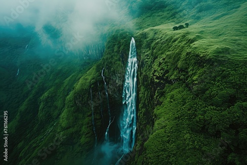 Majestic Waterfall Cascading Through Lush Green Mountain, A stunning aerial view of a waterfall cascading down a mountain, AI Generated