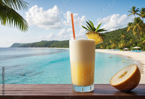 Tropical cocktail Pina colada against the backdrop of beautiful tropical scenery