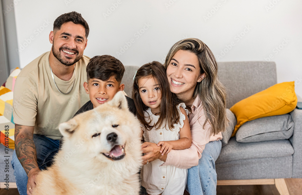 Joyous Family and Dog Posing for a Portrait at Home Joyous Family and Dog Posing for a Portrait at Home