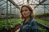 Agricultural portrait of women in greenhouse with greens and salad