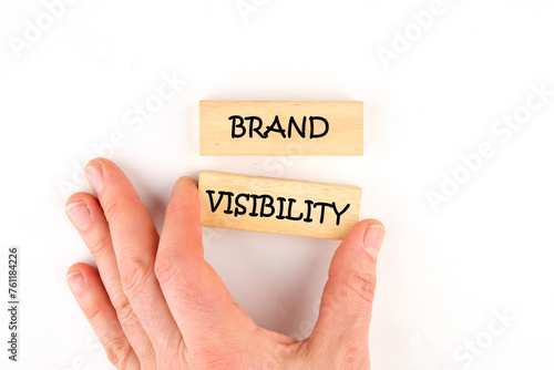 Words Brand visibility on wooden blocks laid out by hand