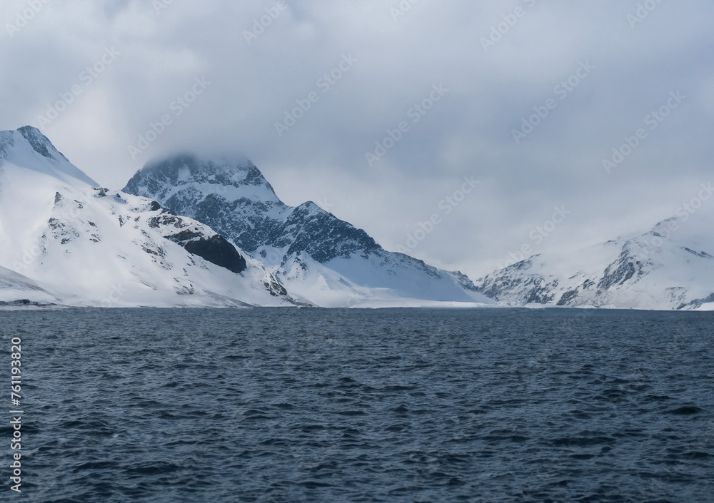 Iceberg in the Swiss Alps under a cloudy sky Iceberg in the Swiss Alps under a cloudy sky