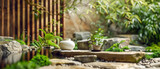 A white vase sits on a stone ledge next to a small garden, promotional sanctuary, ecological
