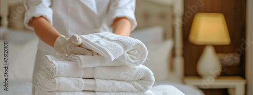 the maid folds the towels. Selective focus. © Яна Ерік Татевосян
