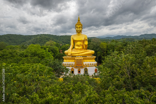 Big Gold Buddha statue at Wat Pha Thang, Uthai Thani, Thailand