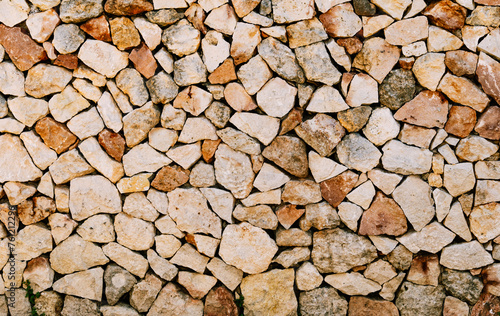 A traditional dry stone wall in Menorca, a construction technique of assembling stones of various shapes and sizes without the use of mortar on the island.