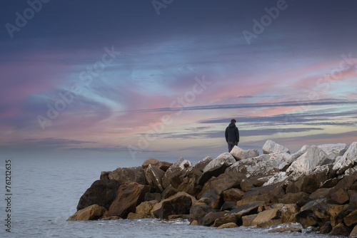 Boy standing on the Cliffs admiring the open Sea, Contemplative Solitude