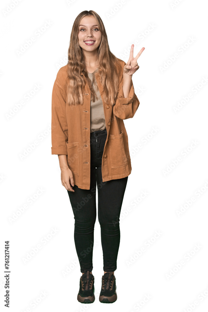 Studio portrait of a blonde Caucasian woman joyful and carefree showing a peace symbol with fingers. Studio portrait of a blonde Caucasian woman joyful and carefree showing a peace symbol with fingers.