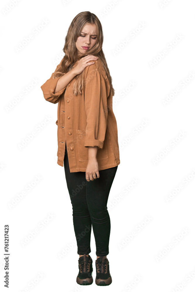 Studio portrait of a blonde Caucasian woman having a shoulder pain. Studio portrait of a blonde Caucasian woman having a shoulder pain.