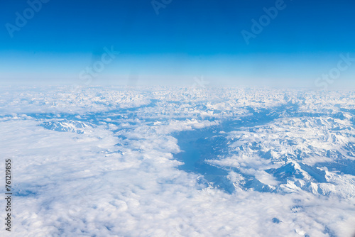 An aerial view of the Alps, a European mountain range and also the highest and most extensive mountain range that is entirely in Europe, stretching approximately 1,200 km across eight Alpine countries