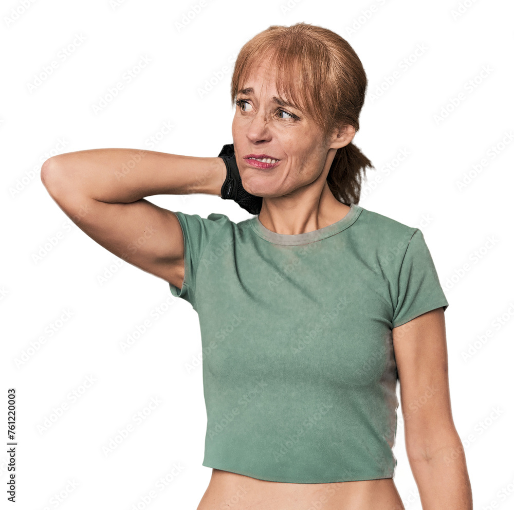 Mid-aged Caucasian athlete with gloves touching back of head, thinking and making a choice. Mid-aged Caucasian athlete with gloves touching back of head, thinking and making a choice.