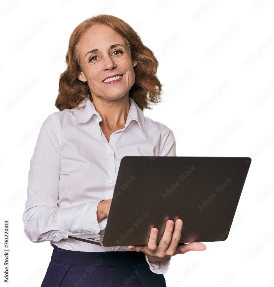 Elegant middle-aged woman confidently working with laptop in studio Elegant middle-aged woman confidently working with laptop in studio