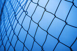 Steel chain link fence as border and obstacle