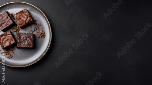 professional food photography top down view with empty copy space. brownies on plate on gray background , still life, minimal modern design