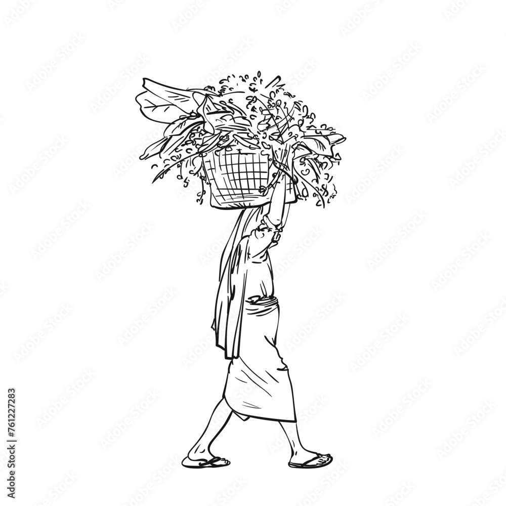 Woman carrying big basket with banana leaves and grass on her head and ...