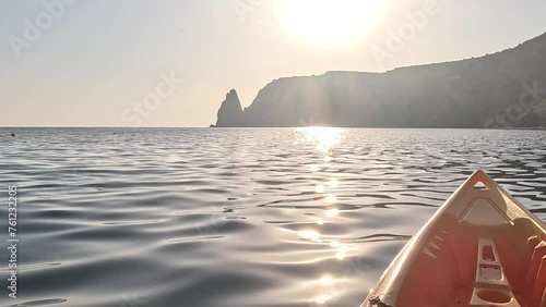 Sea water surface. Low angle view over clear azure sea water. Sun glare. Abstract nautical summer ocean nature. Holiday, vacation and travel concept. Nobody. Slow motion. Weather and climate change photo