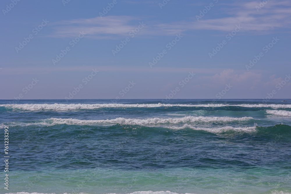 blue sky and blue ocean with waves, serenity and calm, screensaver and background