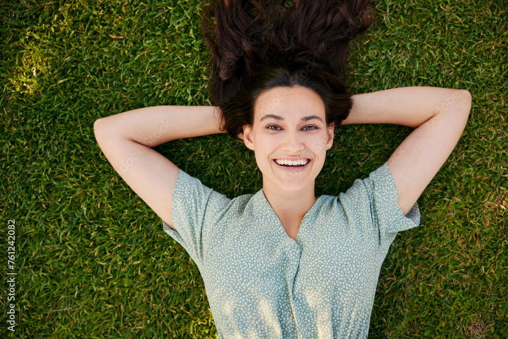 Smiling beautiful woman lying on grass Smiling beautiful woman lying on grass