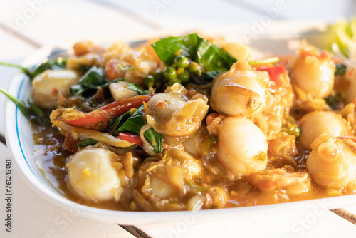 Stir fried spicy scallops with basil and chili.