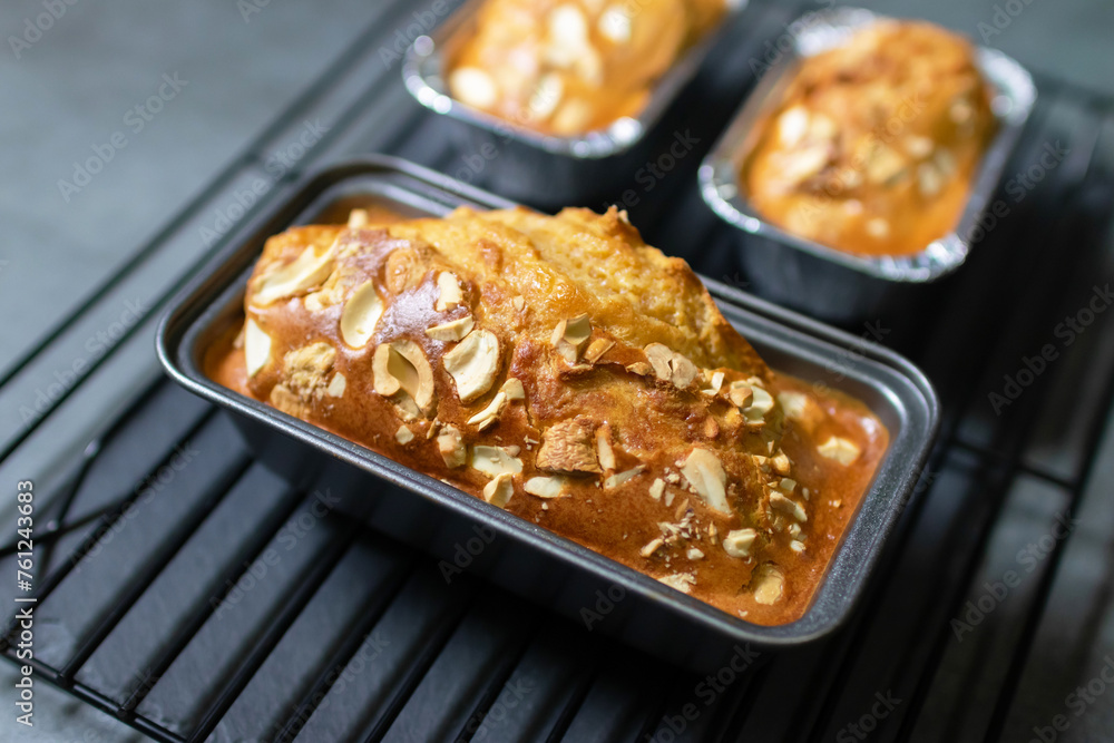 Baked peanut butter cake with nuts on cooling rack. Healthy and easy bake from air fryer.