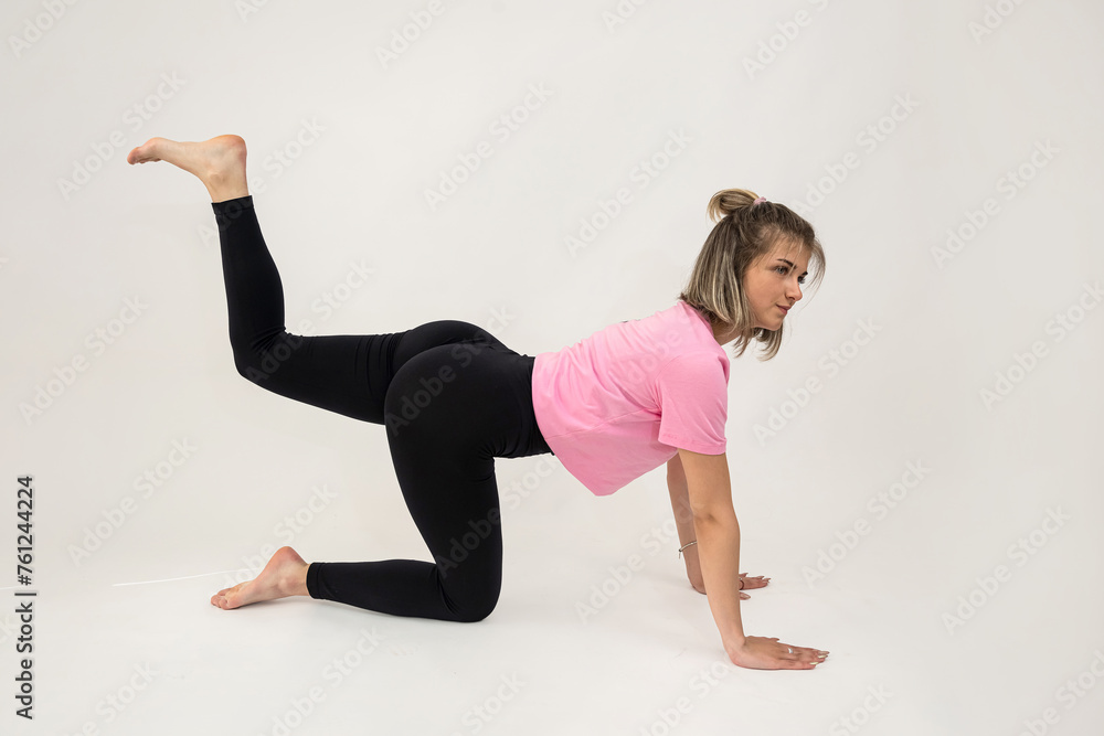 attractive woman trainer make  stretches exercise isolated
