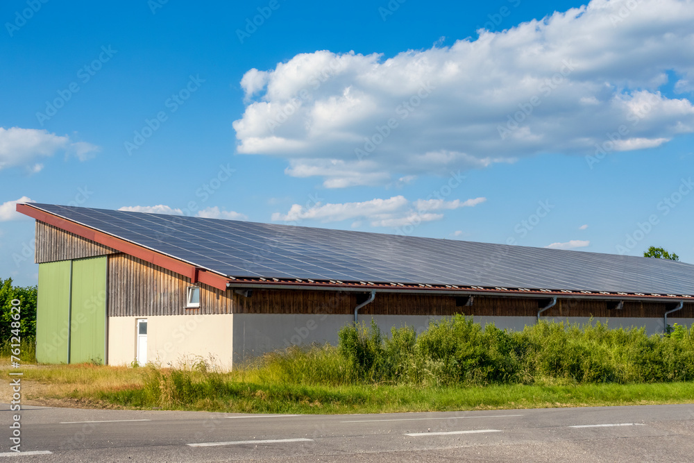 Barn roof with solar panels in Bavaria, Germany on sunny day Barn roof with solar panels in Bavaria, Germany on sunny day