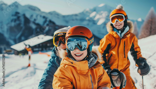 Happy family with two children in ski on the background of snowcovered mountains and skiers