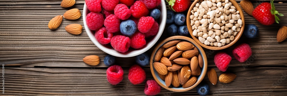 Assorted berries and nuts on wood background, copy space. Healthy and tasty food concept. Flat lay Assorted berries and nuts on wood background, copy space. Healthy and tasty food concept. Flat lay