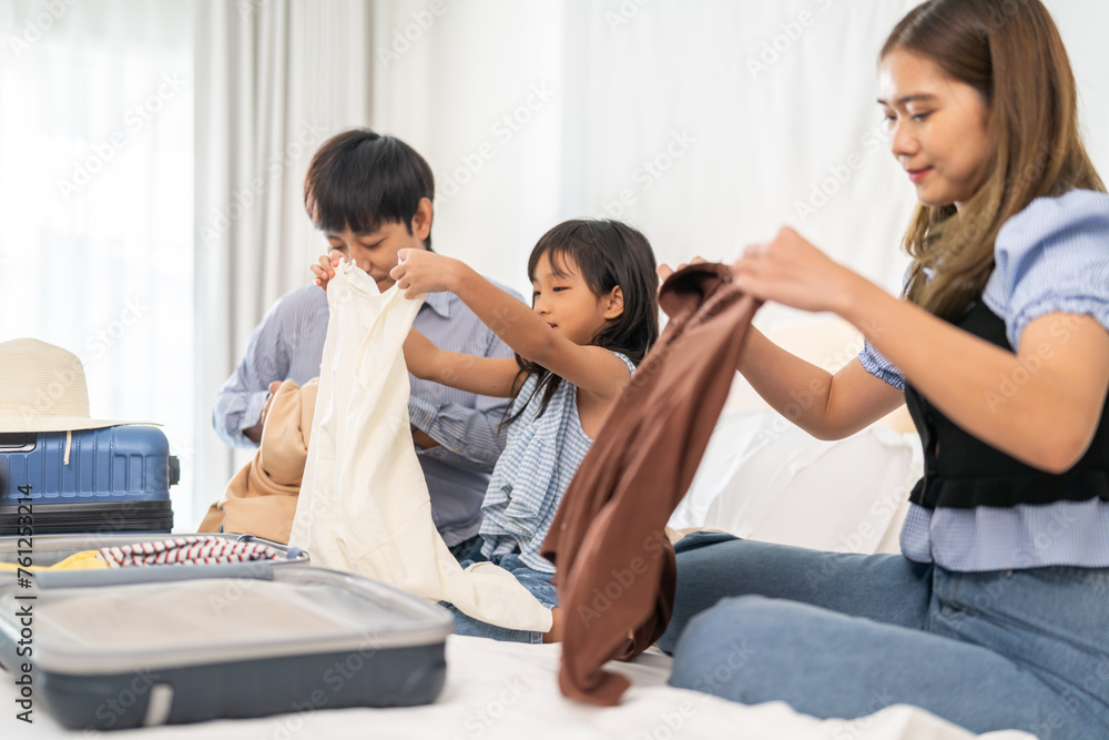 Portrait of happy love asian family father and mother with little girl traveler packing stuff and outfit clothes in suitcases travel bag luggage for summer holiday weekend tourist vacation trip Portrait of happy love asian family father and mother with little girl traveler packing stuff and outfit clothes in suitcases travel bag luggage for summer holiday weekend tourist vacation trip