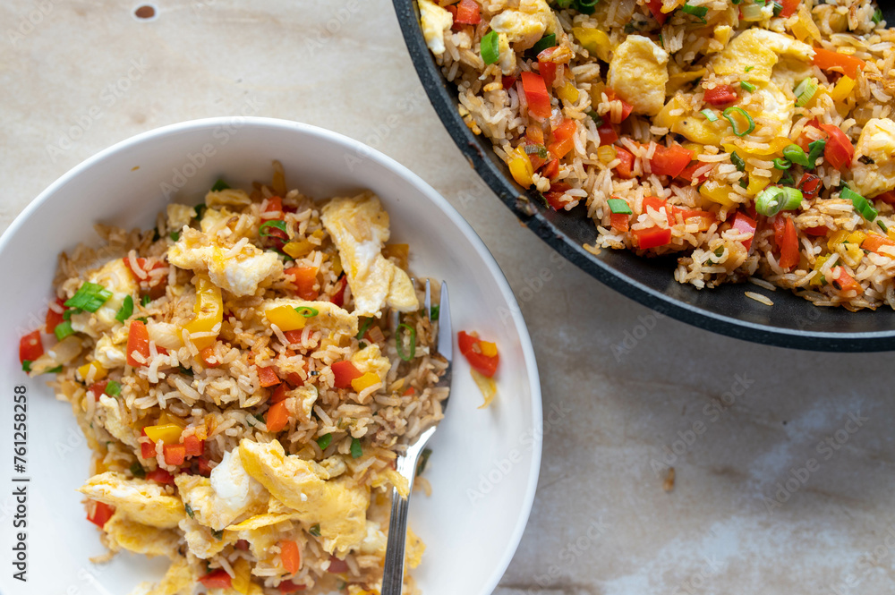 Fried rice with vegetables and scrambled eggs. Healthy vegetarian food. Fried rice with vegetables and scrambled eggs. Healthy vegetarian food.