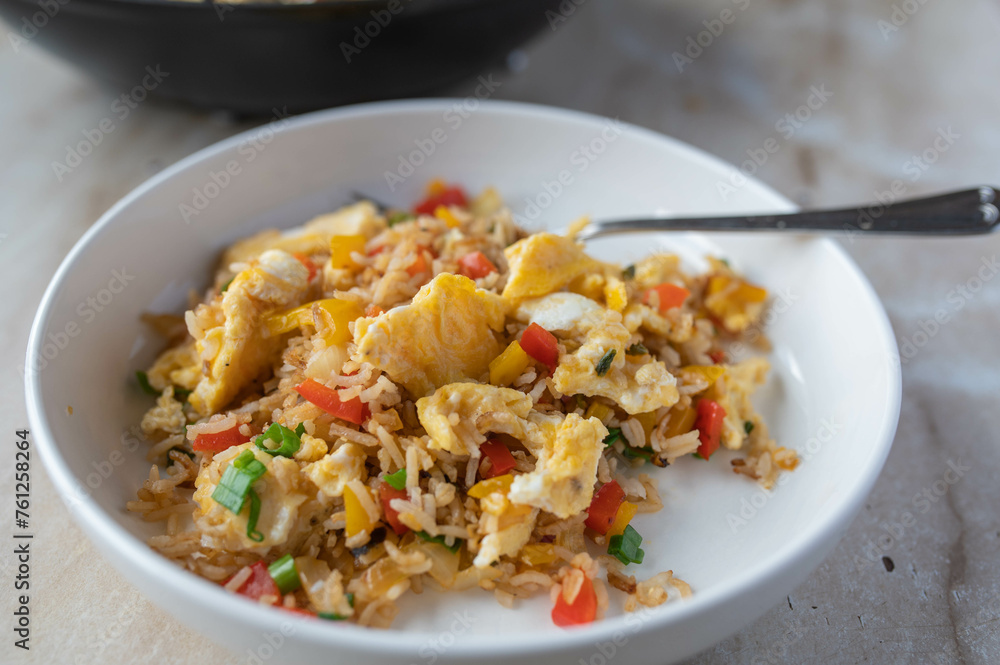 Fried rice with vegetables and scrambled eggs. Healthy vegetarian food. Fried rice with vegetables and scrambled eggs. Healthy vegetarian food.