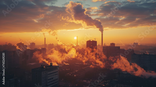 A city skyline enveloped in mist and smoke at sunset, with industrial chimneys emitting smoke against the orange-hued sky