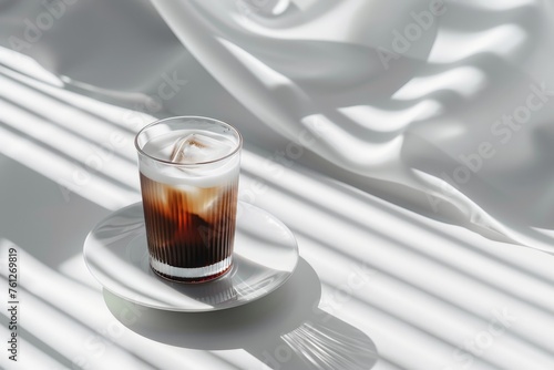 A glass of iced black coffee on white background and Clean composition, minimal style photo