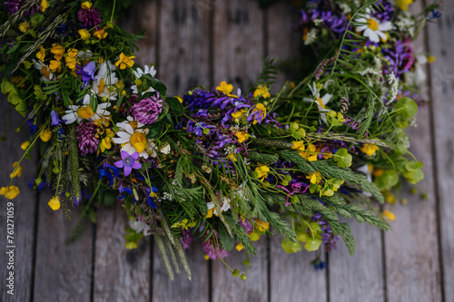 Beautiful floral wreath from meadow flowers. A colorful variety of summer wildflowers.