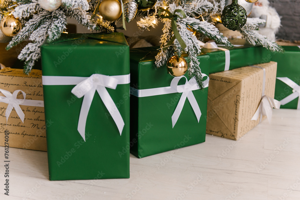 Gifts under the Christmas tree close-up, New Year's decor
